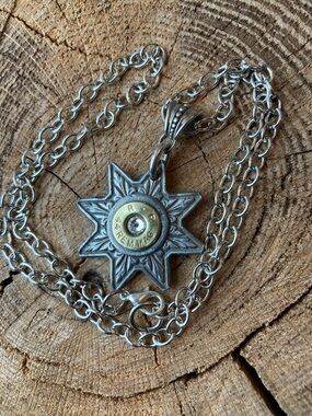 Necklace, spur/ brass casing